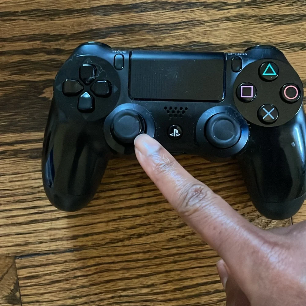 PS4 Console with dual controllers, controller charging station with 16 PS4 games